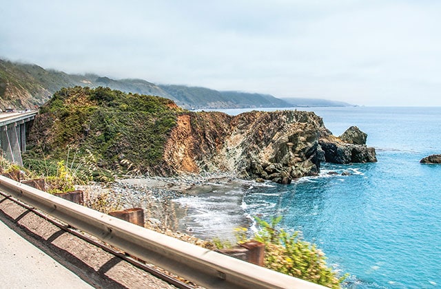view from a bridge off the california coastline