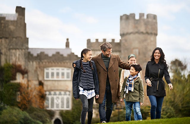 A family in front of a castle in Dublin, Ireland