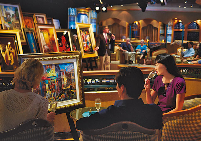 Princess Fine Arts. Three people sitting in chairs looking at artwork