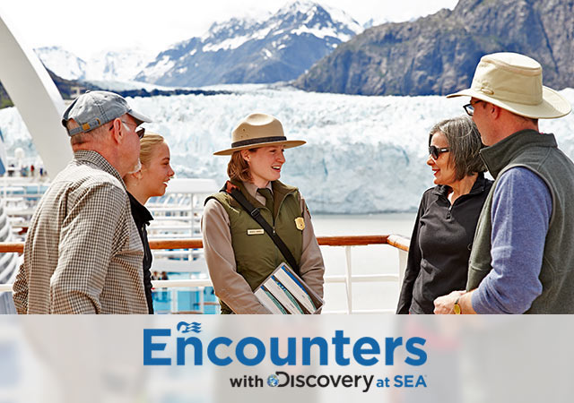 Encounters with Discovery at Sea logo; Alaska ranger talking to four guests onboard a Princess ship in front of snow capped glaciers.